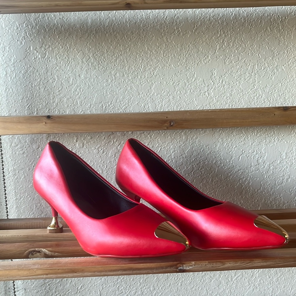 Red kitten heels with gold heart shaped heel